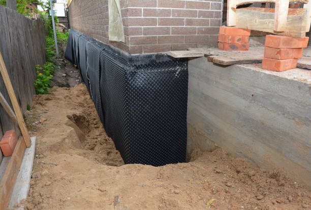 Happy homeowners after waterproofing job in Patuxent River